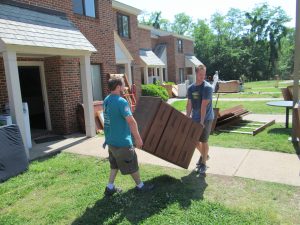 Furniture bank movers moving dresser