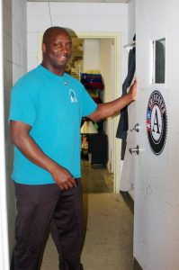 volunteer holding door open