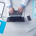 overhead shot of a medical student working on laptop