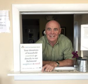 Gary with furniture bank donation sign