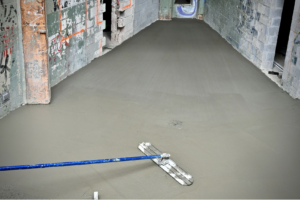 smoothing concrete in revamp of caritas building